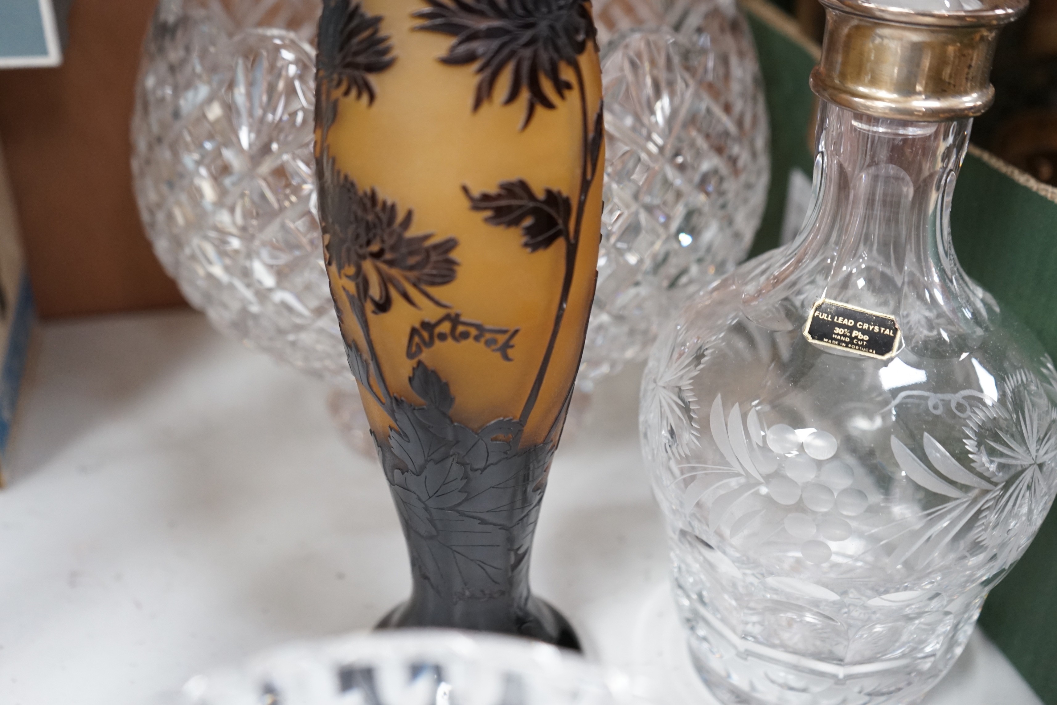 A large Waterford bowl, a biscuit barrel, a decanter with silver neck mount, boxed (Walter Davies) and a Galle style vase, decanter 29cms high